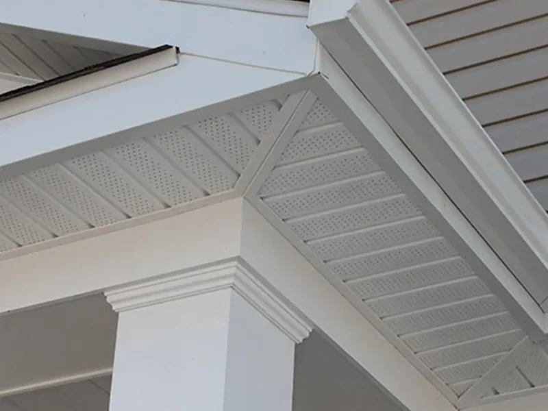 White soffit and fascia beneath a residential roof eave